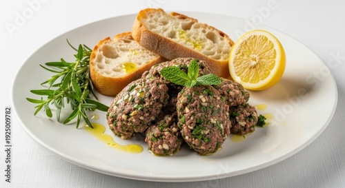 Delicious Mediterranean dish with herb-infused meatballs and fresh bread