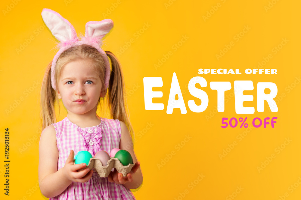 Fototapeta premium Happy Easter celebration with a child holding colorful eggs