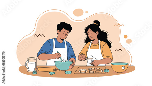 Happy young couple wearing aprons and enjoying quality time together while baking cookies in their kitchen at home.