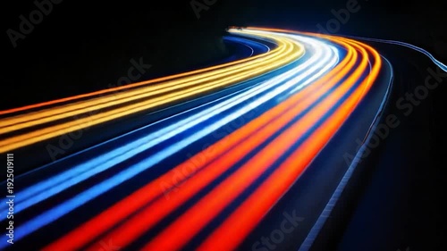 Light trails of various colors curve across a dark background, suggesting motion and speed