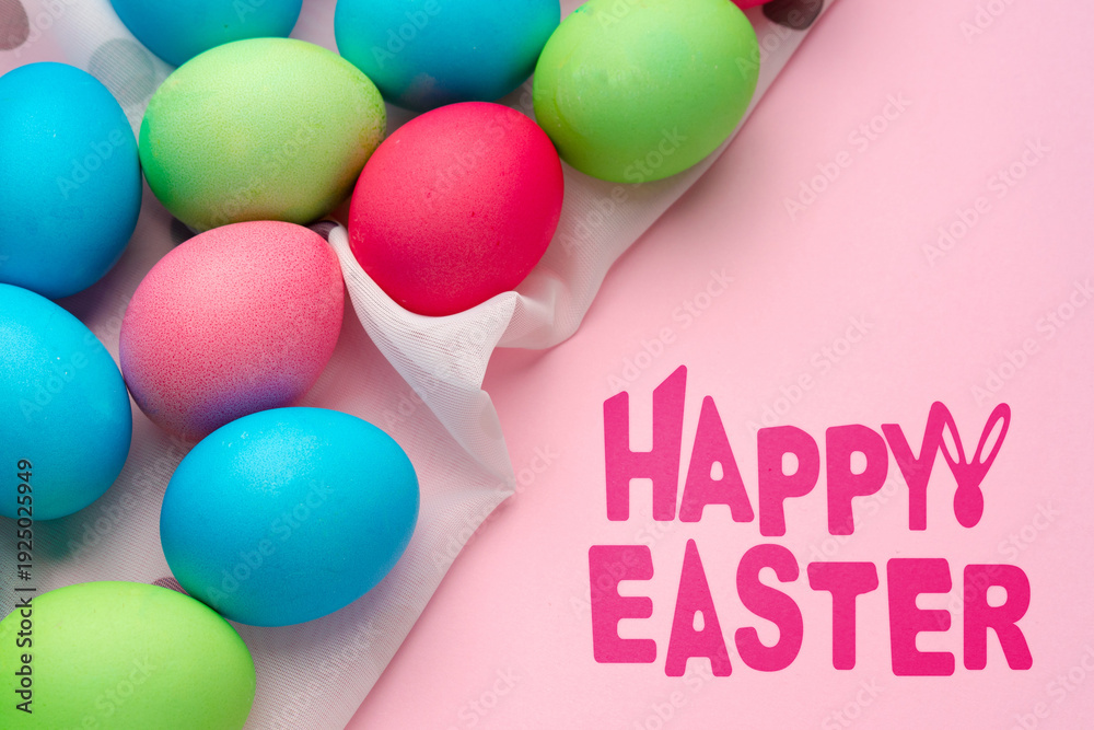 Fototapeta premium Colorful eggs are arranged on a surface for a happy Easter celebration in springtime