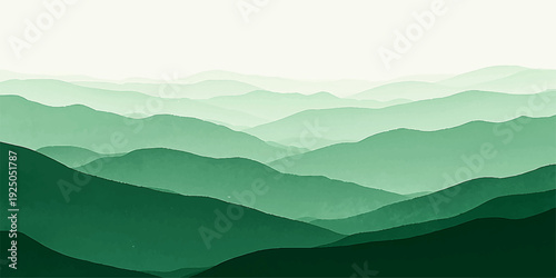 A misty blue mountain landscape at sunrise with clouds and fog veiling the forest hills and distant peaks across a serene valley horizon.