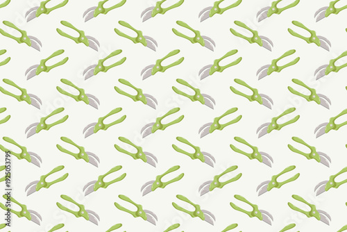 Seamless diagonal pattern of green-handled garden pruning shears with metallic blades on light background, uniform decorative design for wallpaper, fabric, wrapping paper, and gardening projects