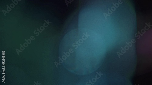 light leak and bokeh overlay with soft blue and green hues, creating a dreamy, ethereal effect. This visual element is perfect for adding atmosphere to videos.