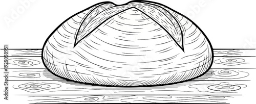 A round loaf of bread with score marks sits on a wooden surface