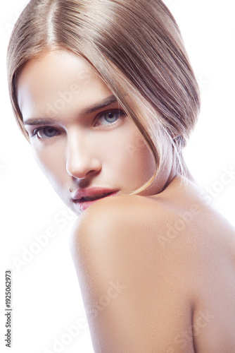 Beauty face of young caucasian model girl with natural day nude makeup, clean skin and blonde hair, blue eyes. Skincare health facial treatment concept