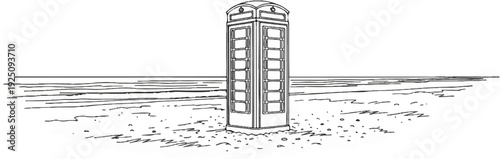 Iconic telephone booth stands on a sandy beach with distant water