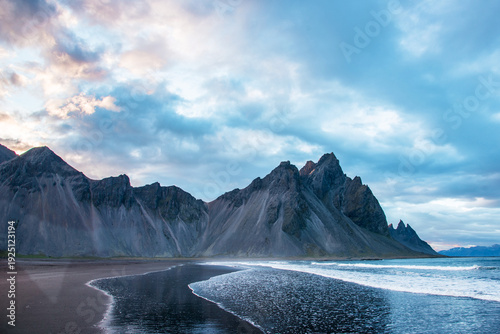 Scenic landscape with most breathtaking mountains Vestrahorn on the Stokksnes peninsula and cozy lagoon in Iceland. Exotic countries. Amazing places.
