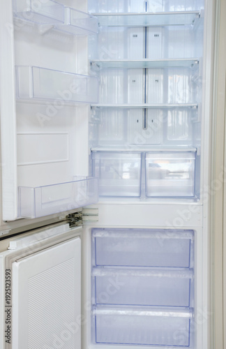 Wallpaper Mural Modern open refrigerator close-up with empty shelves, front view. Torontodigital.ca