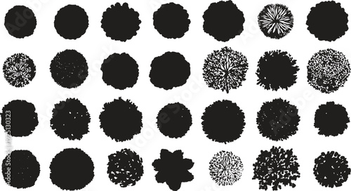 Black silhouettes of various trees seen from above in a grid pattern view aerial