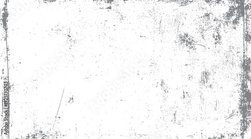 Faded grey grunge texture with distressed marks and speckles on white background