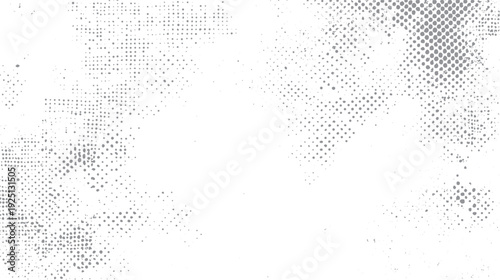 Grey dots and speckles scattered across a white background forming abstract patterns
