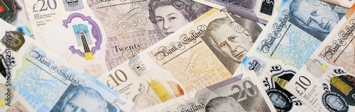 Wallpaper Mural British pound money bills pile on table. United Kingdom banknotes of GBP currency close up. Torontodigital.ca