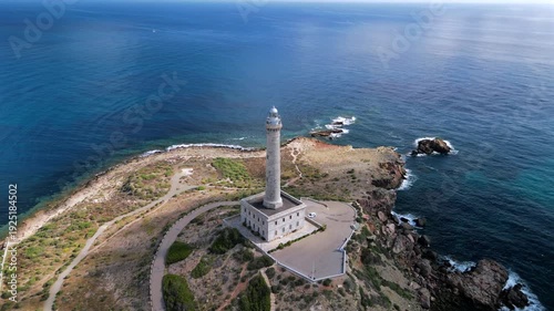 Aerial View of Historic Cabo de Palos Lighthouse on Rocky Mediterranean Coast, Spain

