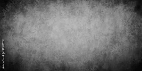 A dark aged grunge metal plate background featuring a rough vintage black texture on a dirty grey concrete surface design with a weathered gray stone pattern