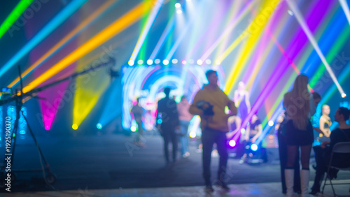Fotografie Abstract Vibrant Concert Stage Lighting with Colorful Bokeh and Audience Silhoue