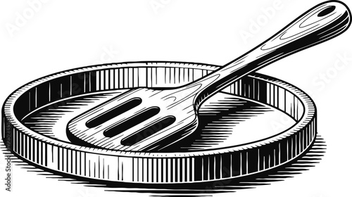 Vintage black and white illustration of a round baking pan and slotted spatula