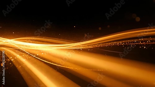 Flowing golden light trails forming smooth abstract curves against dark background creating dynamic motion effect