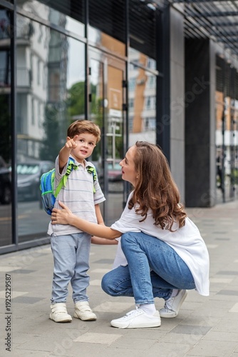 Mother and Son Outside Modern School Building