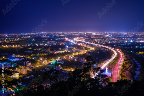 Wallpaper Mural Yilan County Night View - City skyline with car light trails at night in Yilan, Taiwan. Torontodigital.ca