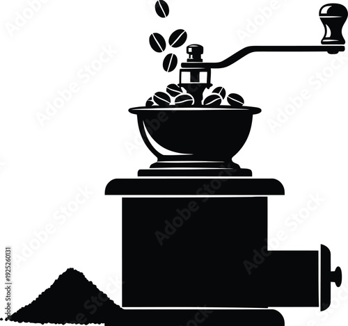 Vintage coffee grinder with falling beans a striking black silhouette