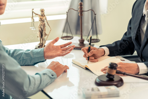 Quadro su tela The lawyer is pointing out the signature points on a legal document with a pen during a legal consultation meeting, representing the client in court and assisting with legal documents