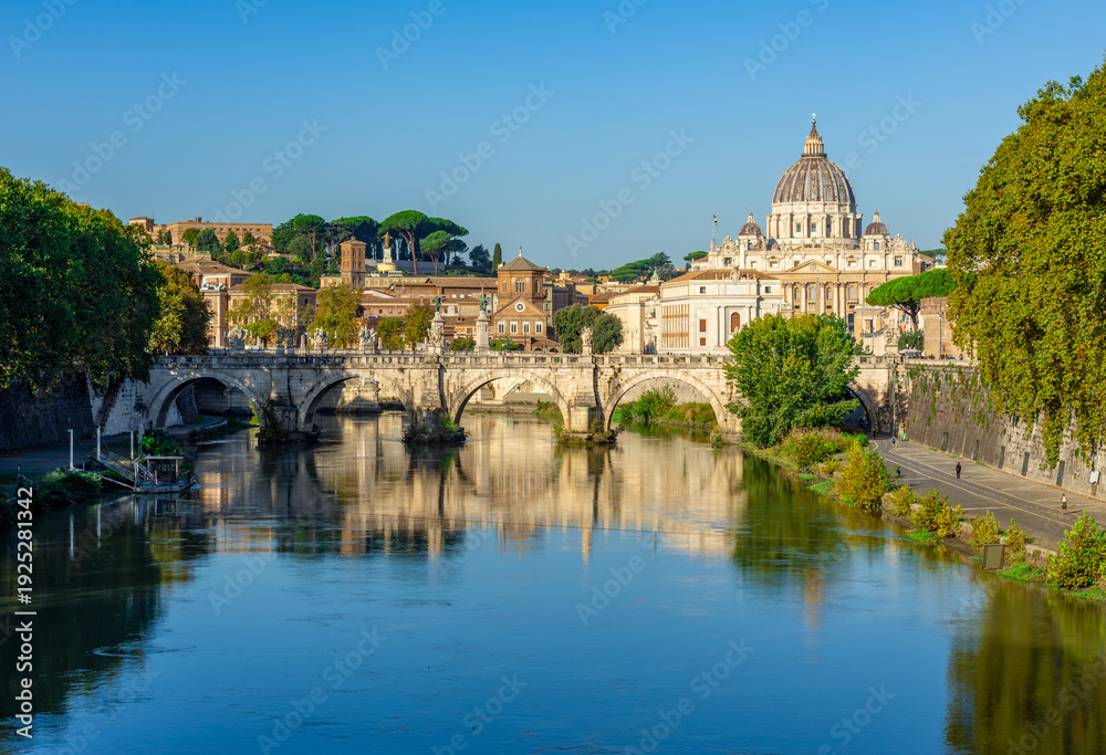 Fototapeta premium St Peter's basilica in Vatican and St. Angel bridge over Tiber, Rome, Italy