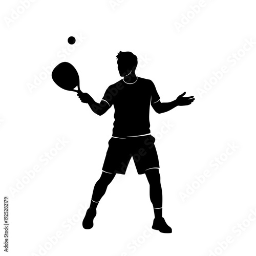 Silhouette of a man playing padel tennis, tossing ball for serve