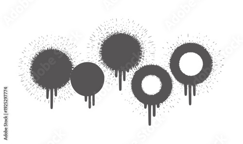Dark grey paint splatters and drips forming circles and blobs