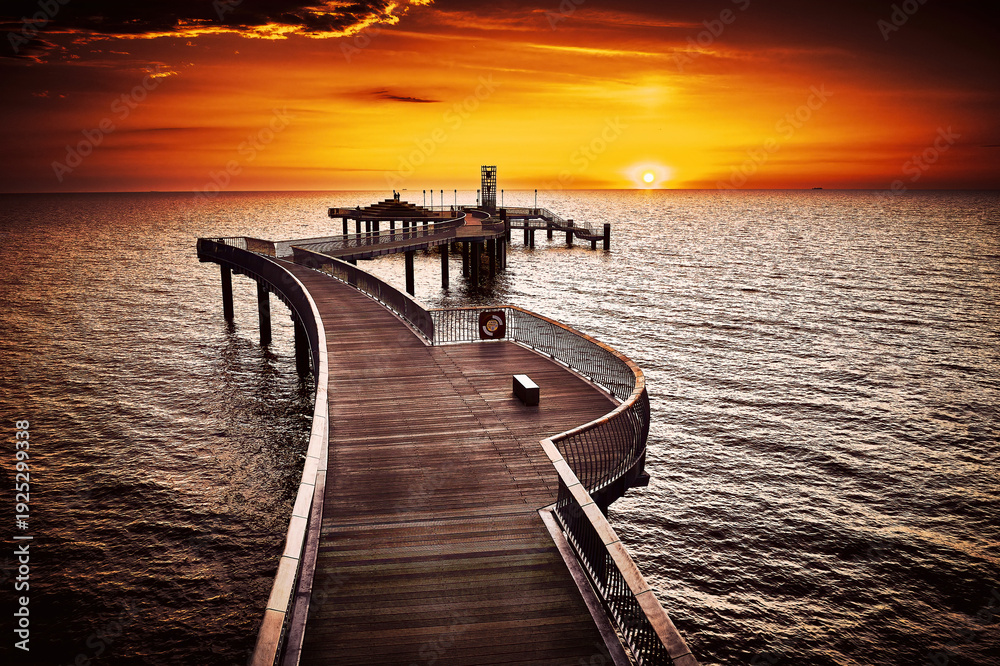 Fototapeta premium Dramatic Sunrise Over Koserow Pier