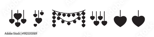 Various heart shaped decorations hanging from strings forming lovely romantic garlands and festive ornaments
