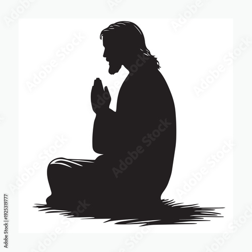 silhouette of a man sitting praying