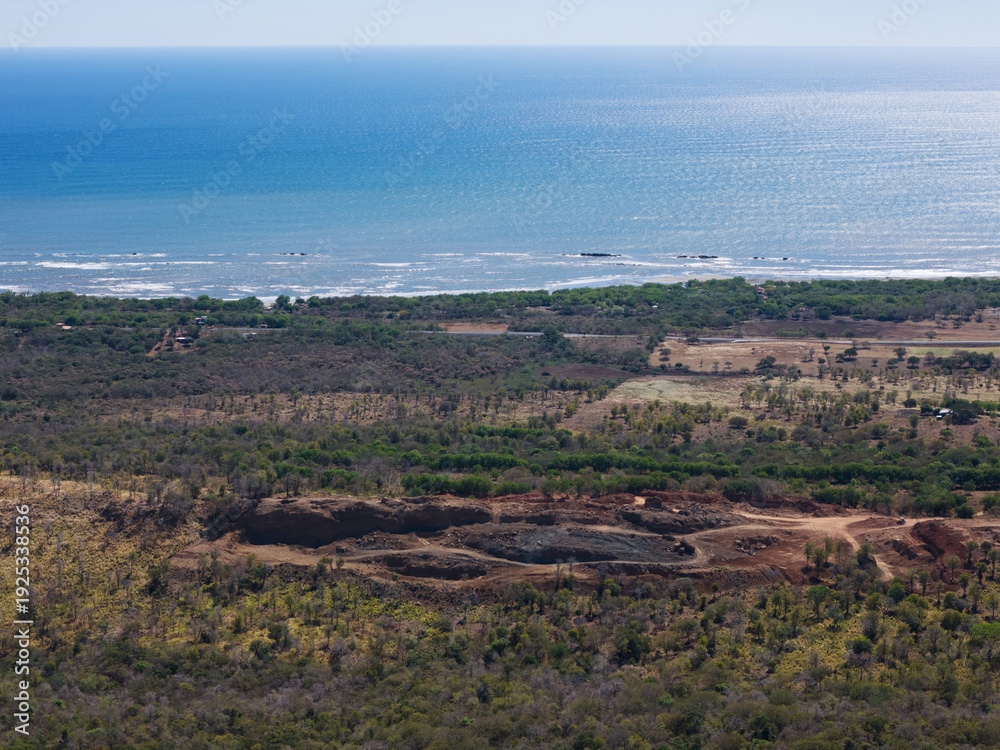 Naklejka premium Sand quarry next to ocean beach