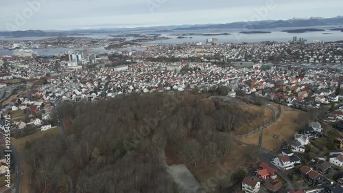 Wallpaper Mural Aerial drone footage showing vehicle traffic moving through a suburban area in Norway during late winter. The scene captures residential neighborhoods, roads, and surrounding landscape under cold seas Torontodigital.ca