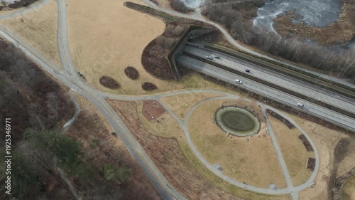 Wallpaper Mural Aerial drone footage showing vehicle traffic moving through a suburban area in Norway during late winter. The scene captures residential neighborhoods, roads, and surrounding landscape under cold seas Torontodigital.ca