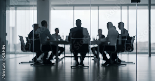 Professional team engaged in strategic discussion inside a sleek office boardroom, surrounded by glass panels and city views, with soft light and motion blur adding dynamic atmosphere.