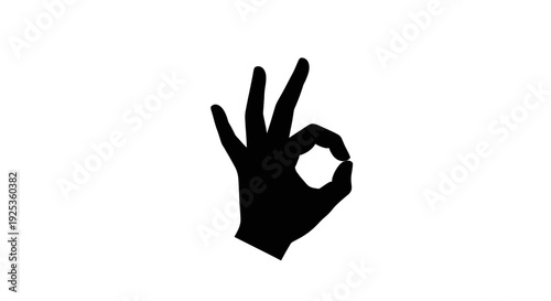 A solid black hand gesture forming the "OK" sign, symbolizing approval, agreement, and positive feedback, on an isolated white background.