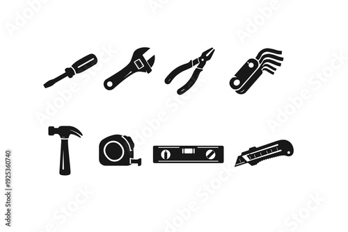 Set of black silhouette hand tools on white background