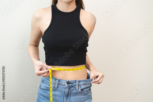 Canvastavla Diet, slim shape asian young woman, female standing, hand using measure tape around waist, body