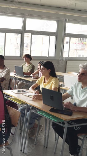 Diverse group of high school students listening to a lesson