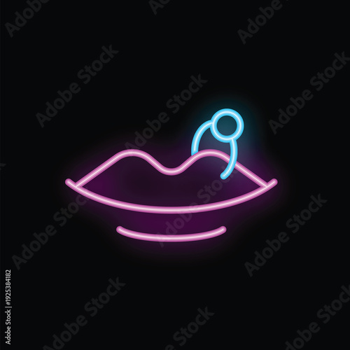 Bright pink and blue neon sign showing lips with piercing on black background