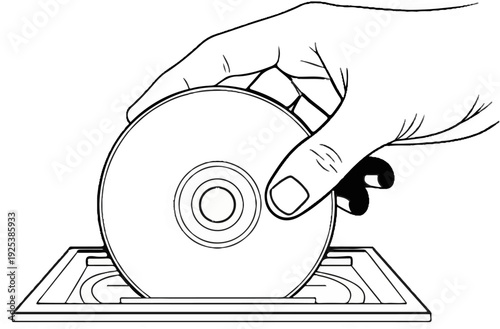Hand inserts disc into a disk drive for data storage or media playback