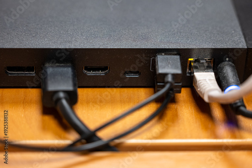 Obraz na plátně Close up of media device back panel with HDMI, USB and Ethernet cables connected