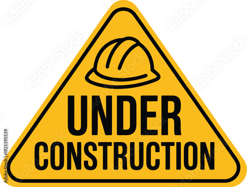 A yellow triangular sign indicating a construction zone ahead