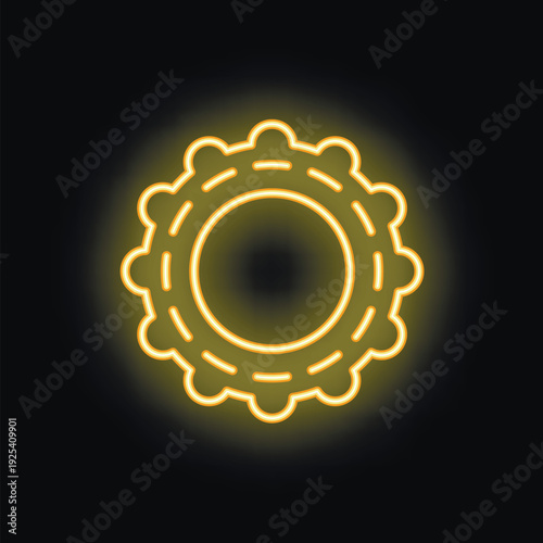 Bright yellow neon sign of a virus glowing on a black background