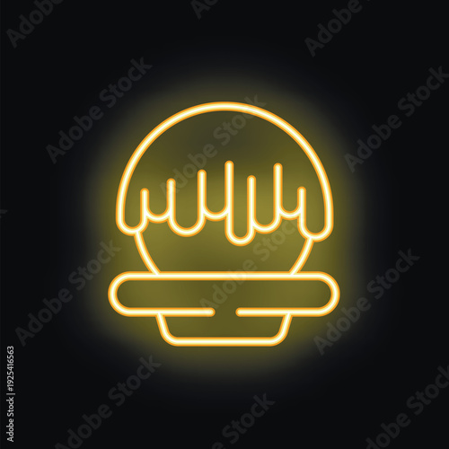 Yellow neon sign of a chocolate cake with melted chocolate on top, isolated on a black background