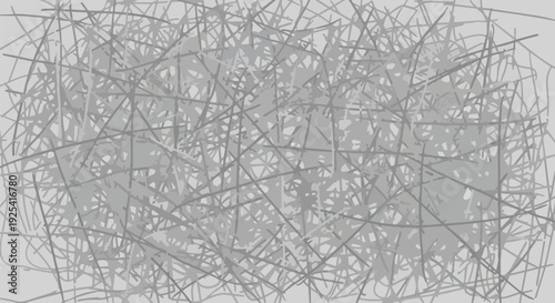 Intricate grey abstract tangle of overlapping lines and fragmented shapes creating a complex web background.