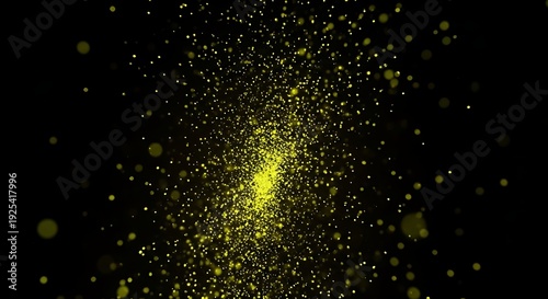 Bright yellow light particle explosion on black background