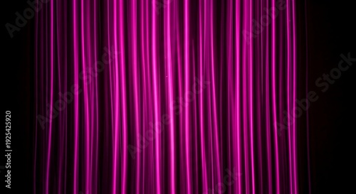Vibrant pink and purple light streaks on black background