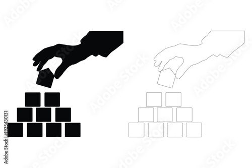 Hand Stacking Blocks Creating a Pyramid Silhouette
